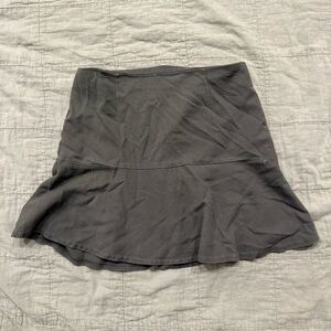 Women's 27'' waist dark green mini skirt with a flowy, boho vibe.